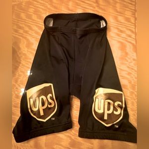 Voler padded Bicycle/Spinning shorts with Team UPS logos. Large. Black & Gold.